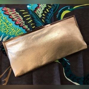 Hobo International gold leather slim clutch w/ aged brass metal frame.